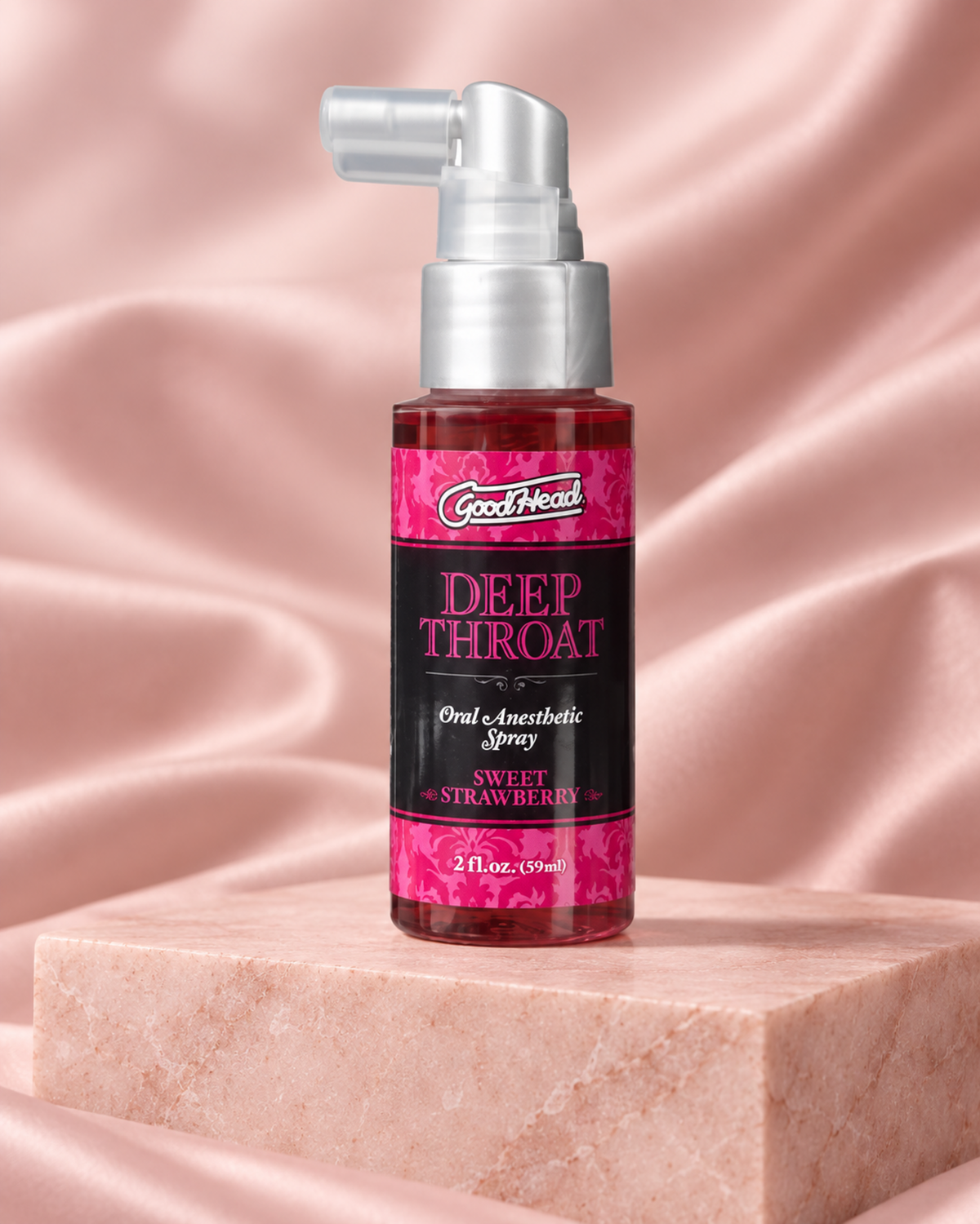 Doc Johnson Good Head Sweet Strawberry oral comfort spray 59ml on a blush-pink studio set