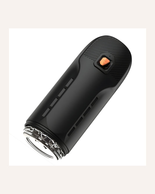 Angled view showing the REV male masturbator controls and removable sleeve opening